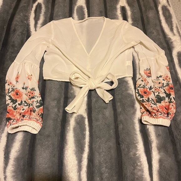 This is a sheer floral puff sleeve top. - Picture 1 of 3